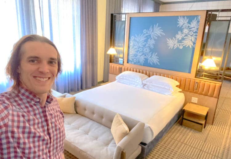 View of the author in a suit at the Hotel Monaco in Denver, Colorado