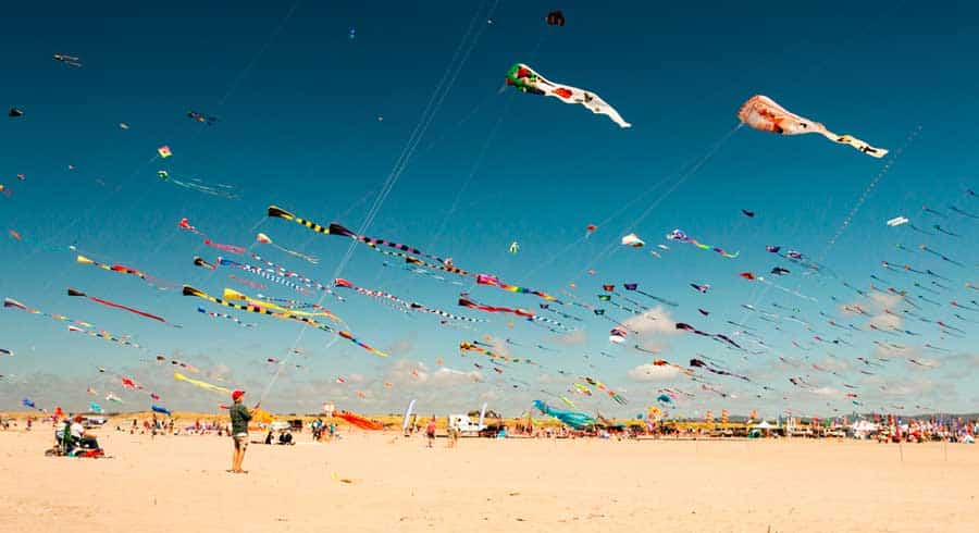 Colorful kites up in the sky of Long Beach during Kite Festival