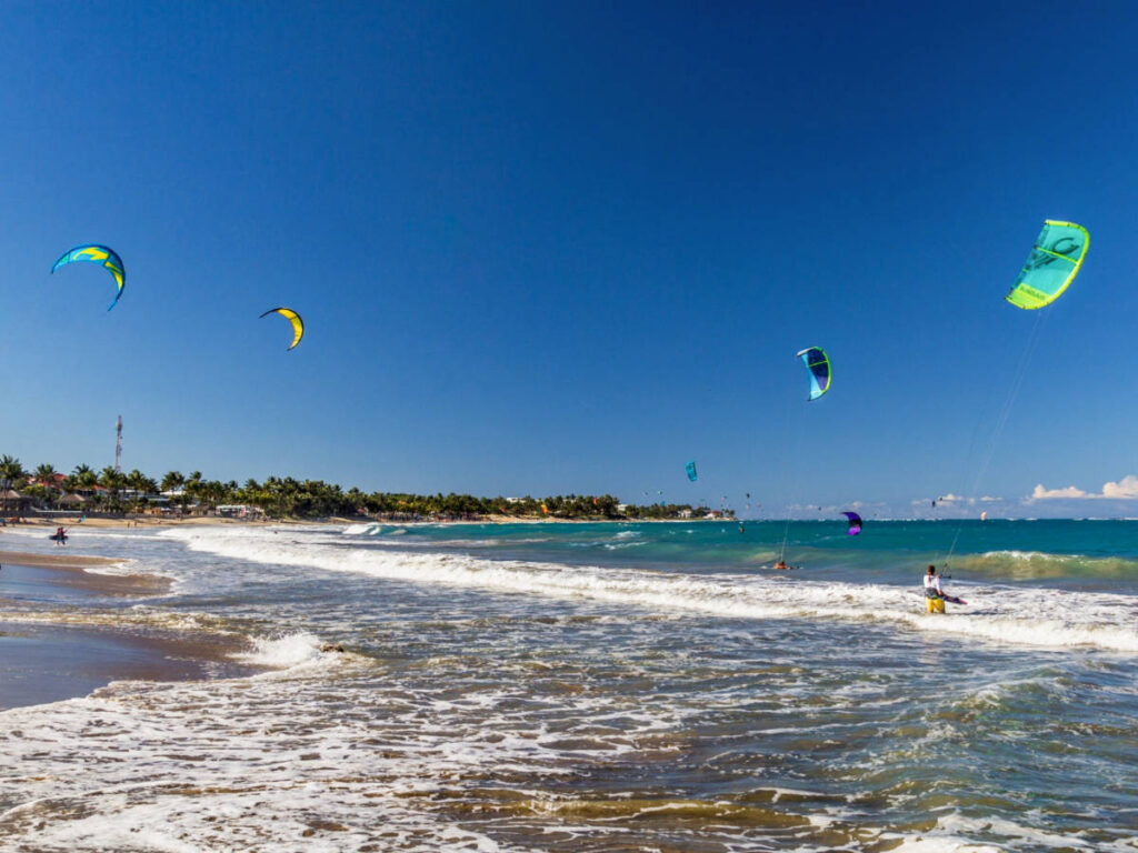 View of the people kiteboarding on the beach of Cabarete