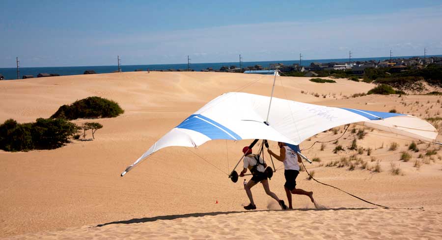 People enjoying hand gliding in Kitty Hawk