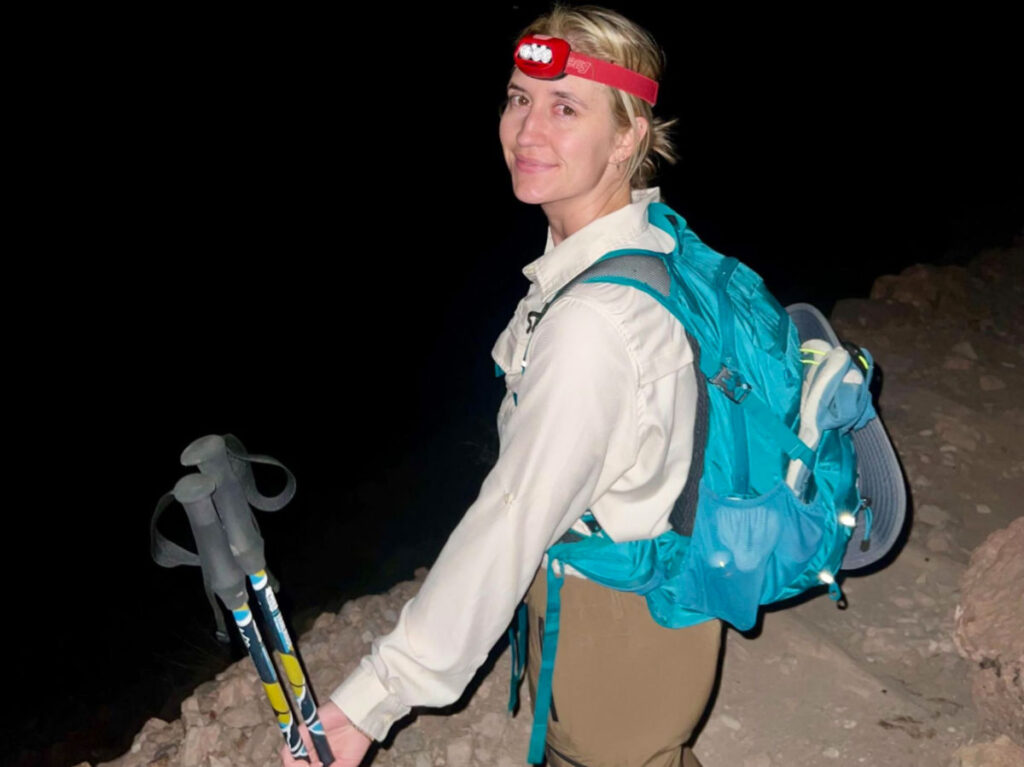 Author's friend Kiva rocking her headlamp in the dark hours while hiking