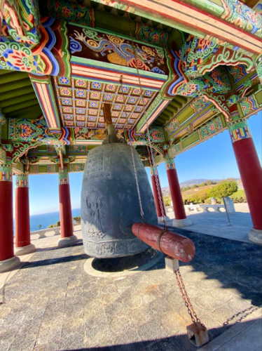A large Korean Bell of Friendship inside a Korean style enclosure