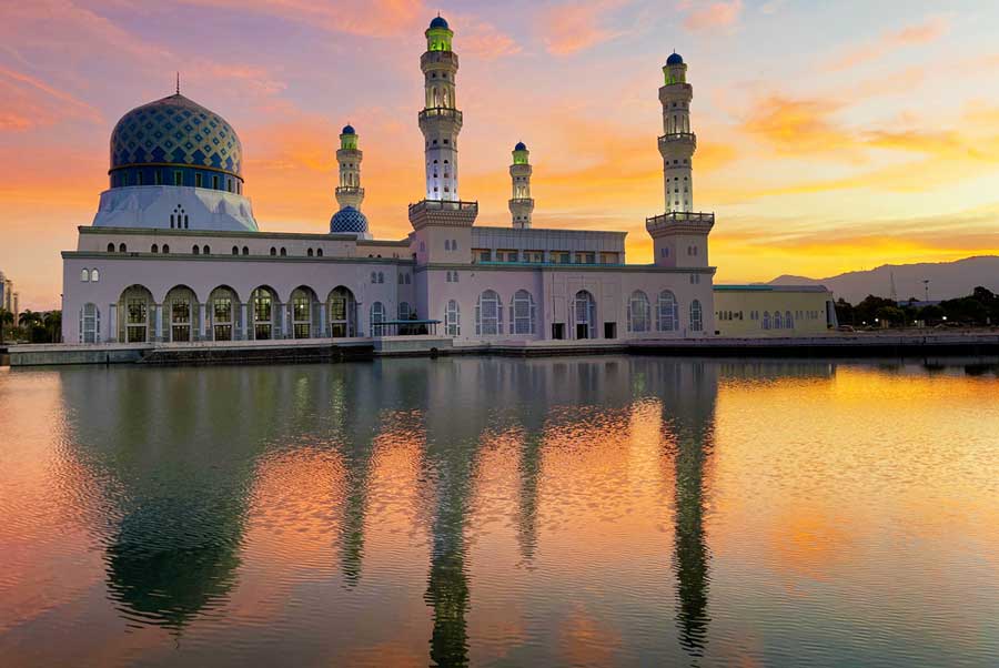 The Kota Kinabalu City Mosque and its reflection on the water during sunset