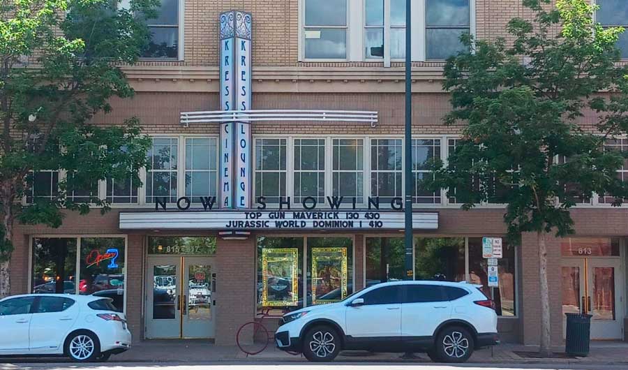 Cars parked in front of the Kress Cinema & Lounge building