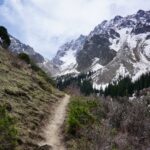 The hiking trail surrounded by mountain ranges in Kyrgyzstan