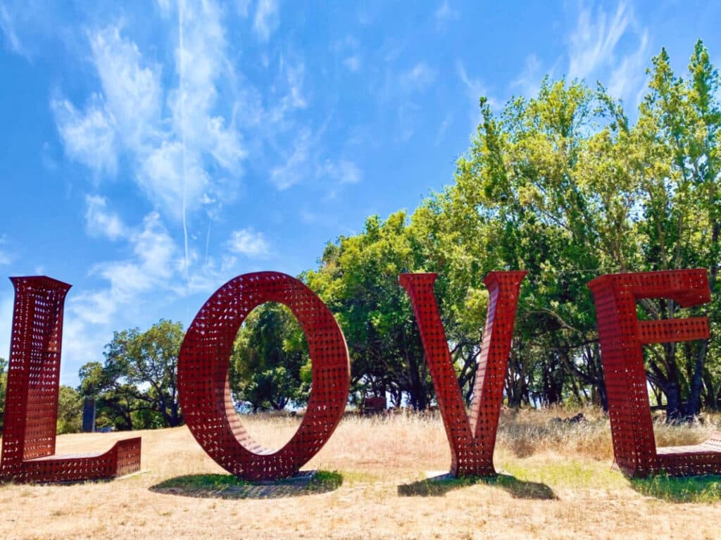 View of the huge red LOVE sculpture in Marijke’s Grove
