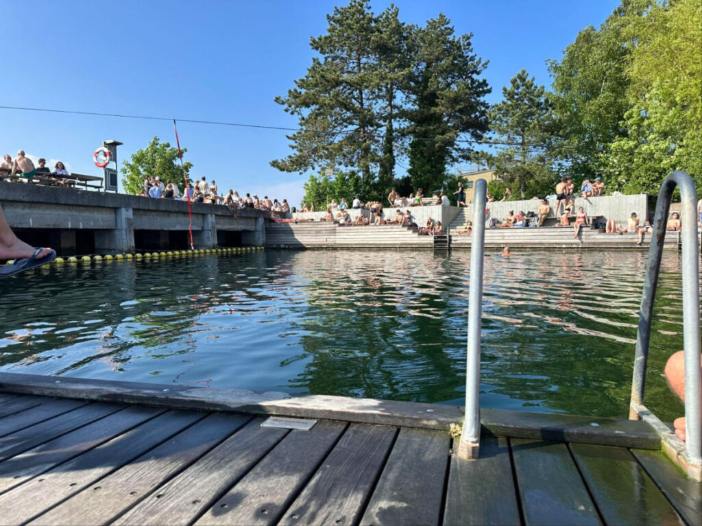 Group of people relaxing on the floating docks at La Banchina
