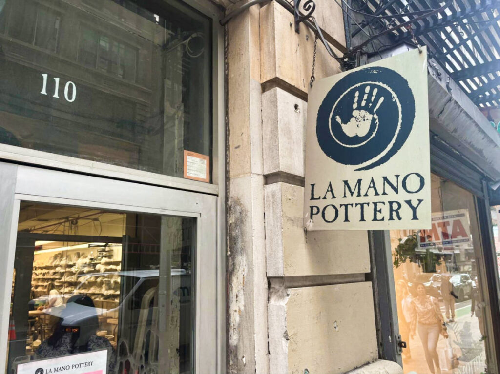 The signage of La Mano Pottery outside the building