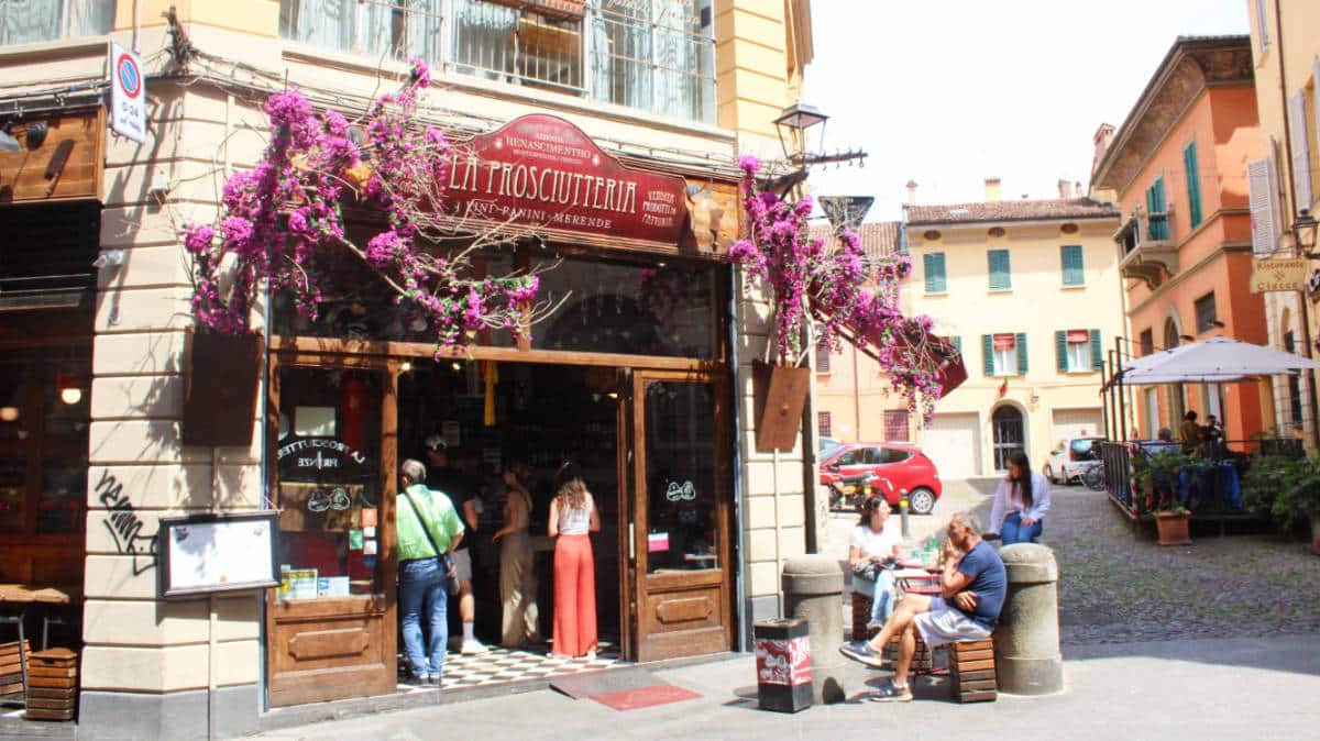 View of people outside the La Prosciutteria in Bologna
