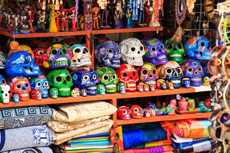 Colorful skulls displayed on a market in La Quinta Avenida
