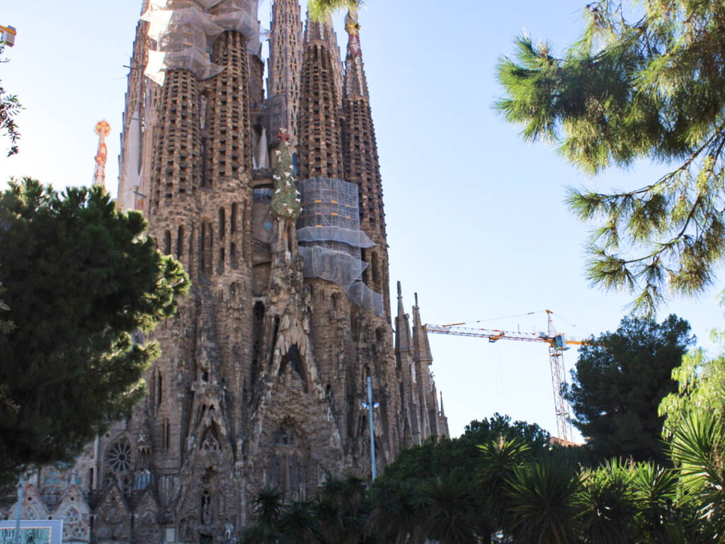 View of the ongoing construction of the La Sagrada Familia from the Placa de Gaudi