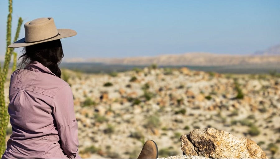 The author (McKenna Mobley) overlooks the canyon below.