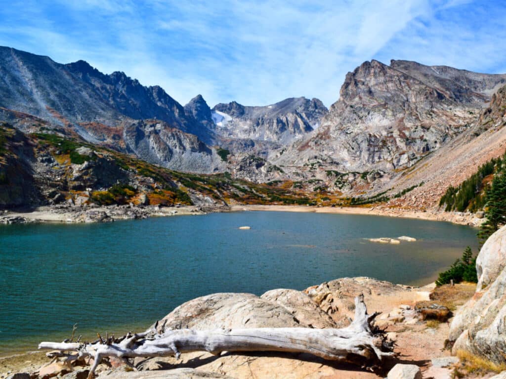 View of Lake Isabelle in the middle of rocky mountains at Brainard Lake Recreation Area