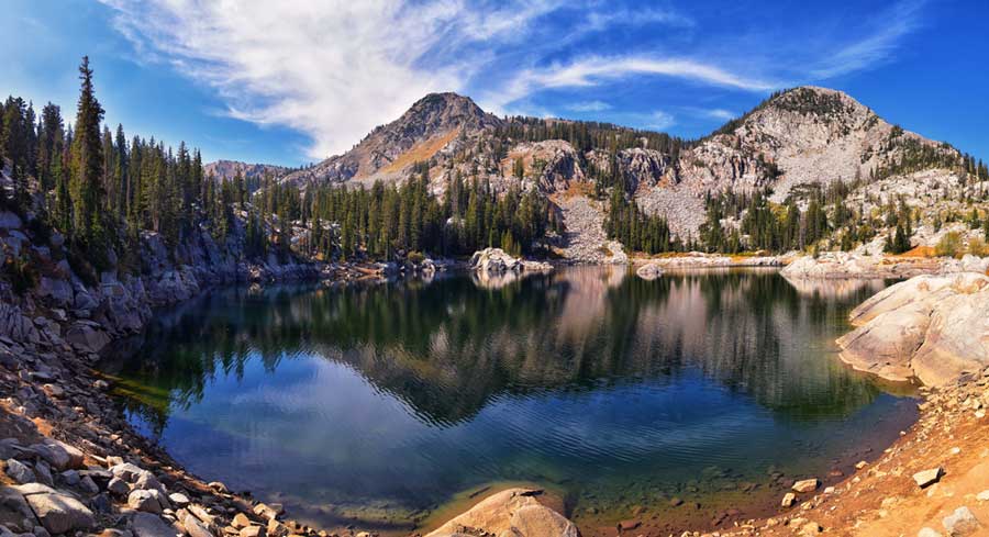 Scenic view and reflection of a mountain on a lake in Lake Mary Trail