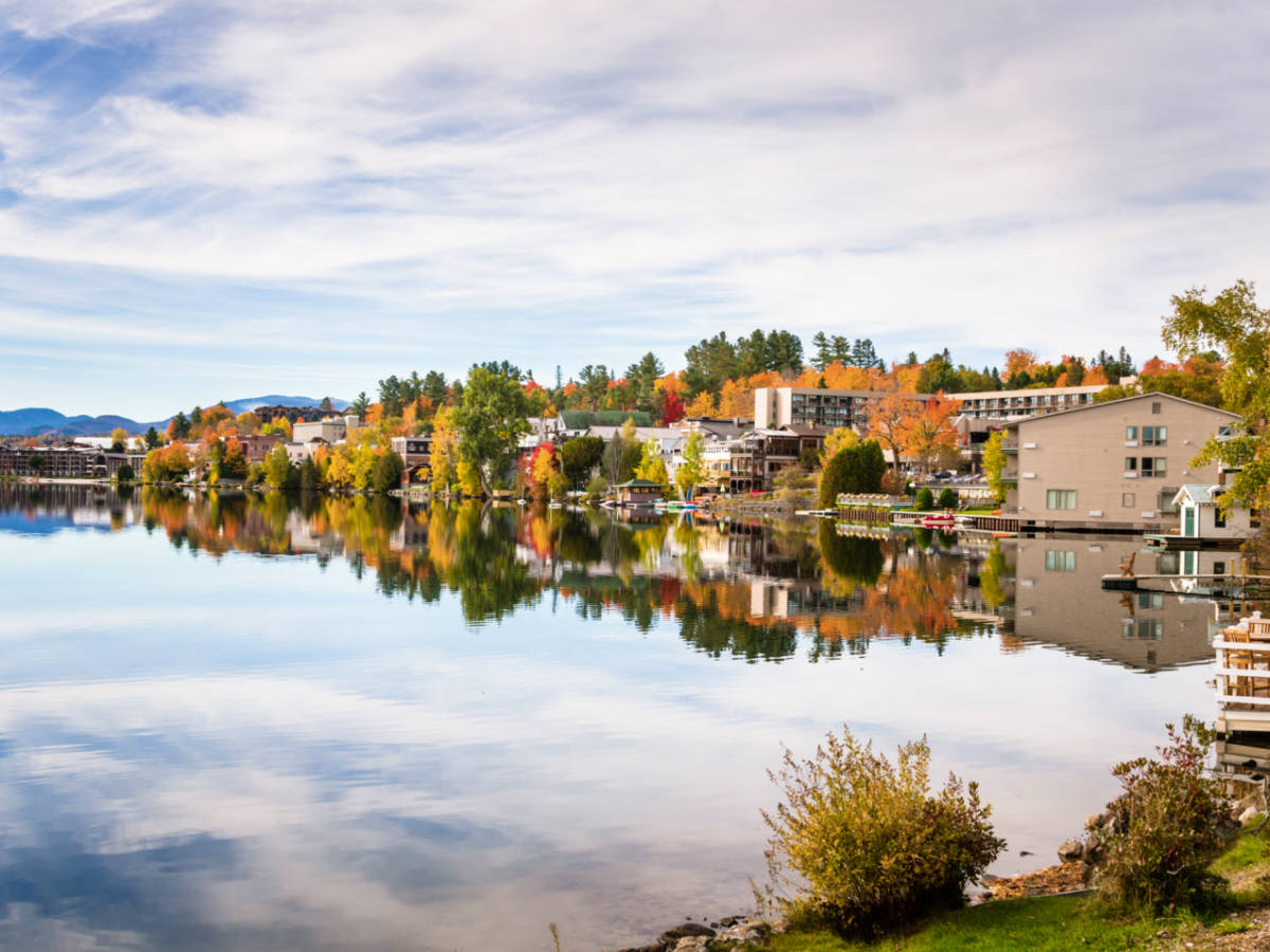 View of the fall foliage around a neighborhood on Lake Placid