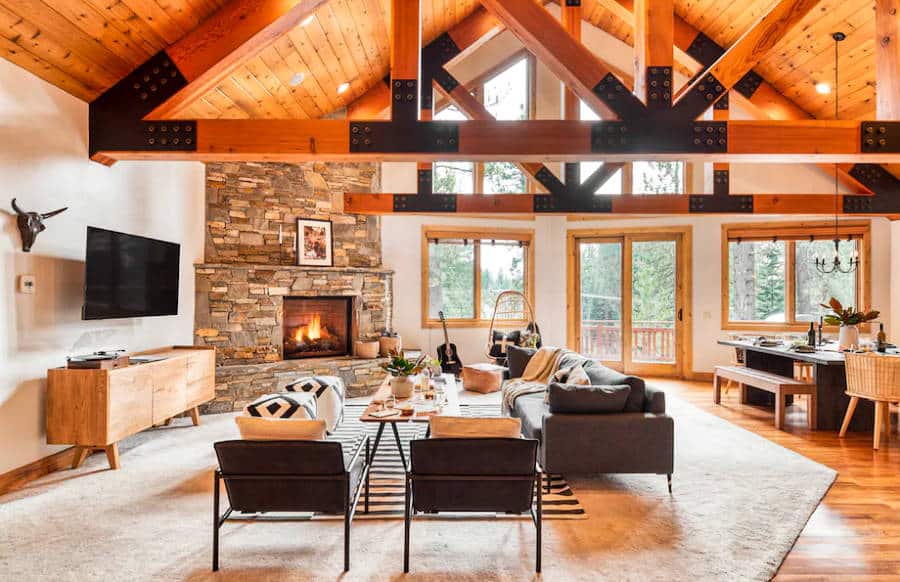 Interior view of the cozy rental cabin with a lit fireplace