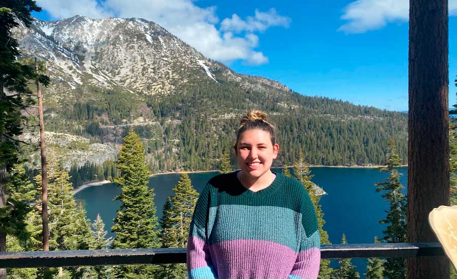 Travel Lemming's writer Bailey with the Lake Tahoe on he background