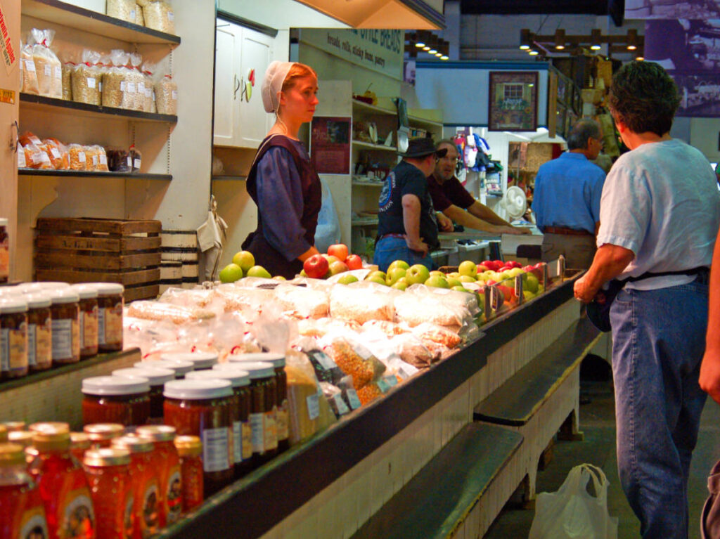 A Mennonite woman selling at a market in Lancaster