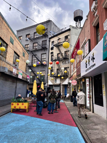 View of the colorful lanterns over the street in Chinatown NYC