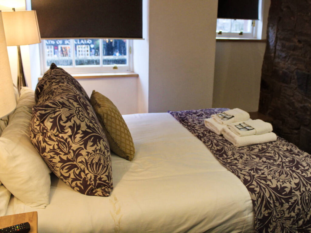 A large bed in the Royal Mile Romance Studio