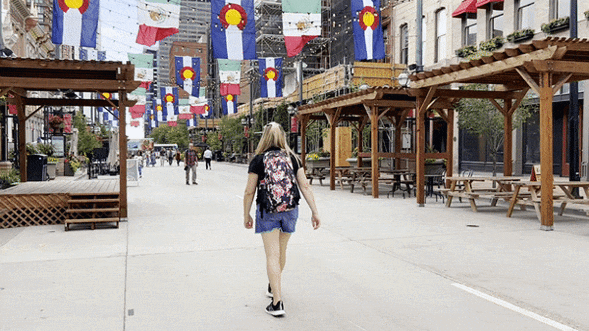 Travel Lemming writer, Laura Falin walking at Larimer Square