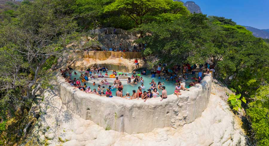 People soaking in a pool in Las Grutas de Tolantongo