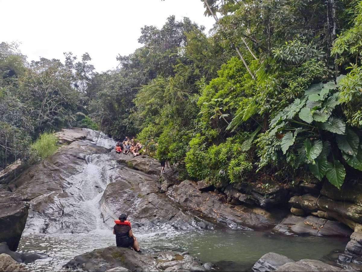 People enjoying their day at one of the waterfalls in El Yunque, the Las Paylas