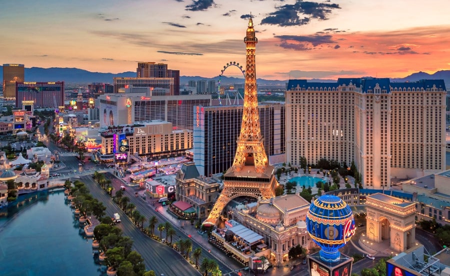 Illuminated Las Vegas Eiffel Tower in the middle of the famous Vegas Strip at sunrise