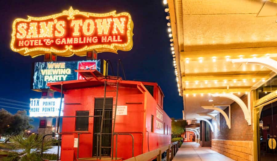 Night exterior view of the fancy signage and lights of Sam's Town Hotel & Gambling Hall.