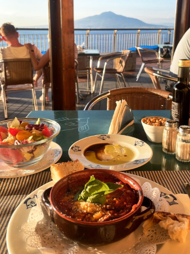 A lasagna from La Marinella with Mount Vesuvius views