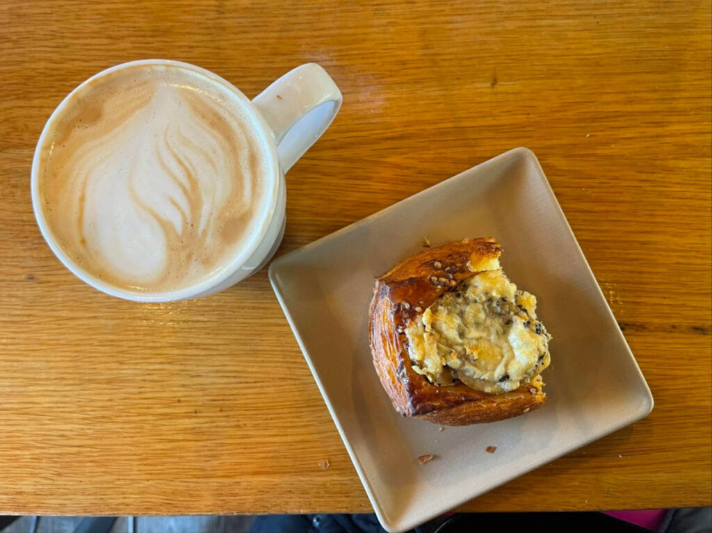 Top view of the Latte and croissant at Sofra Bakery & Cafe