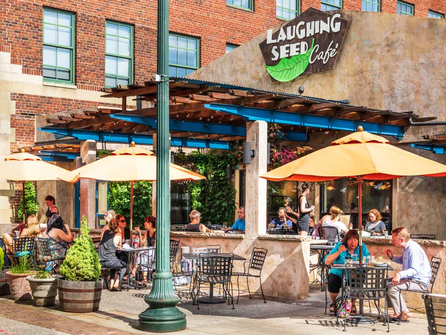 View of people enjoying their foods in Laughing Seed Cafe