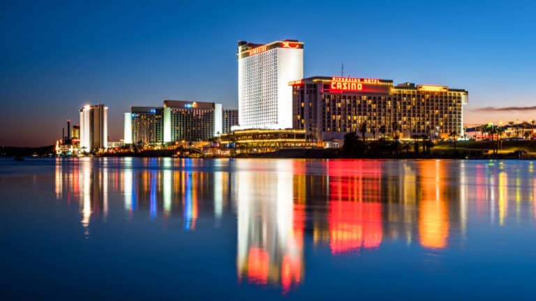 Illuminated lights of the Laughlin hotels and casino reflected on The Colorado River
