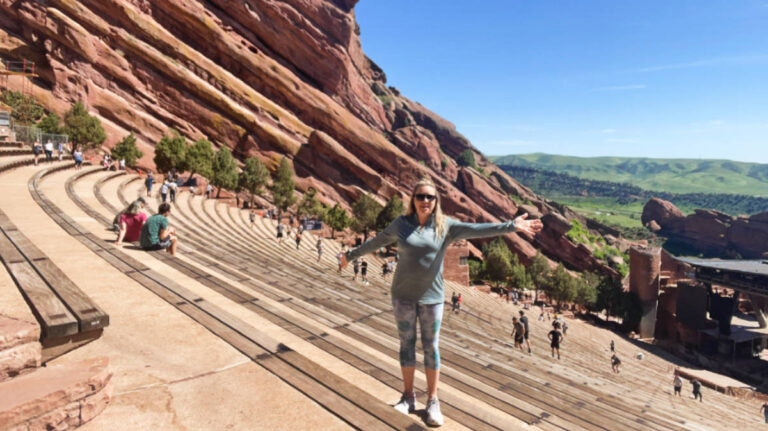 The author, Laura Falin posing for a photo at the Red Rocks Amphitheater