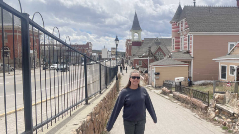 The author Laura Falin, enjoying at the side of the street of Leadville