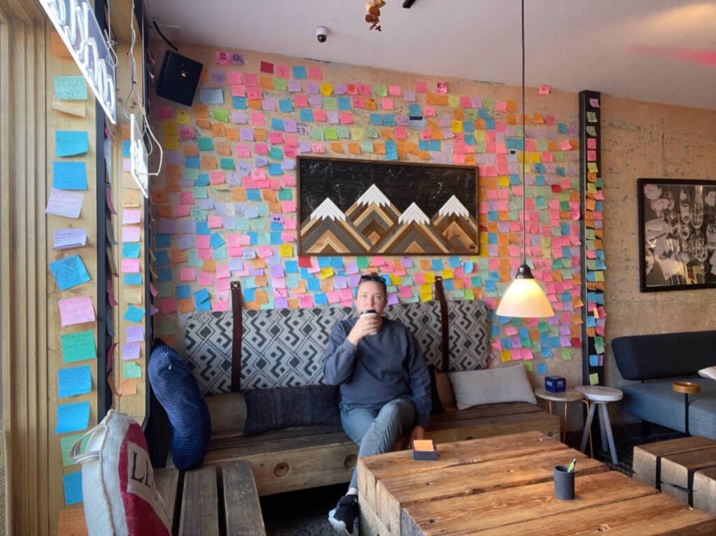 The author Laura Falin drinking coffee inside the Before & After Coffee Shop