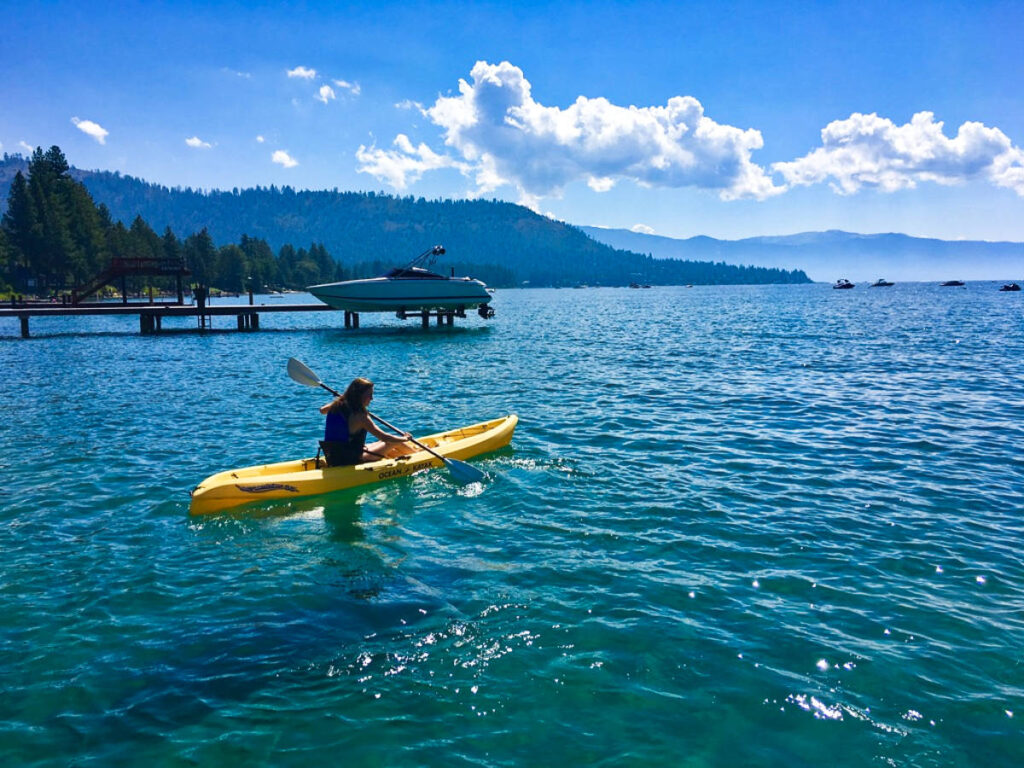 The author Laura McFarland, kayaking on a sunny day in Kings Beach