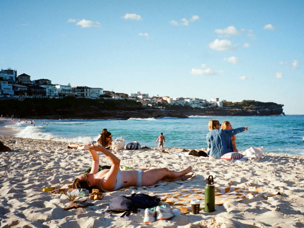 The author Laura McFarland lounging at the beach with the crowd