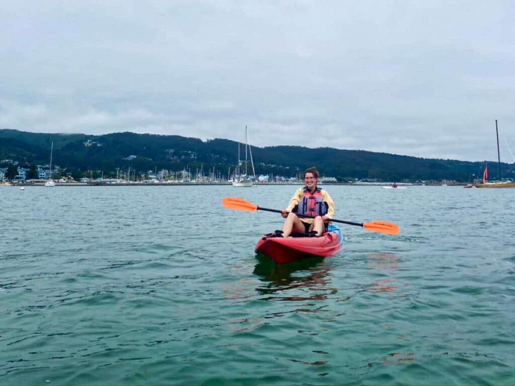 The author Laura McFarland, kayaking on Half Moon Bay