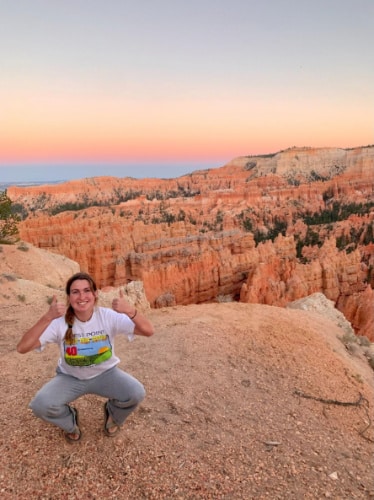 Laura McFarland posing for a photo during sunset at Bryce Canyon National Park, Utah