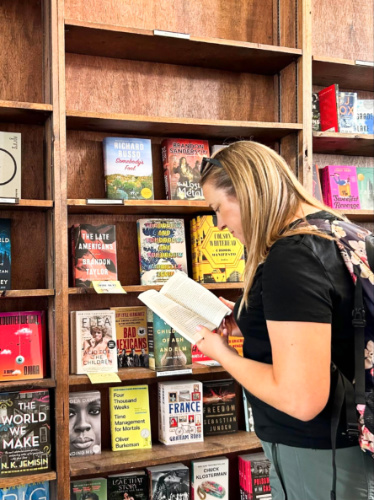 The author Laura Falin reading a book at Tattered Cover