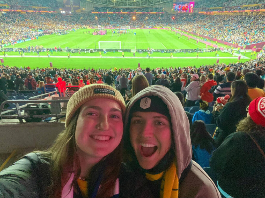 The author Laura McFarland and her partner watching the Women’s World Cup match at the stadium