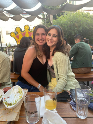 The author Laura McFarland and her friend in the backyard beer garden