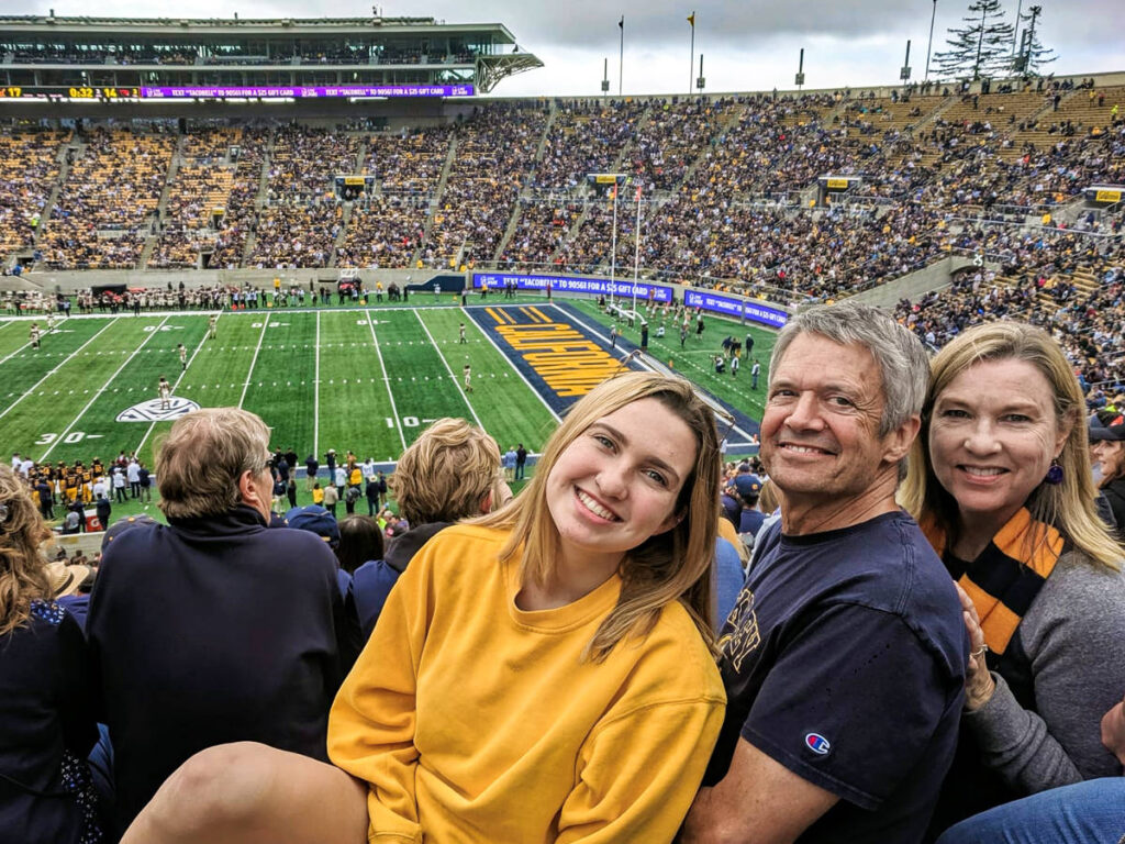 Travel Lemming Writer Laura McFarlan with her parents at a UC Berkeley football game