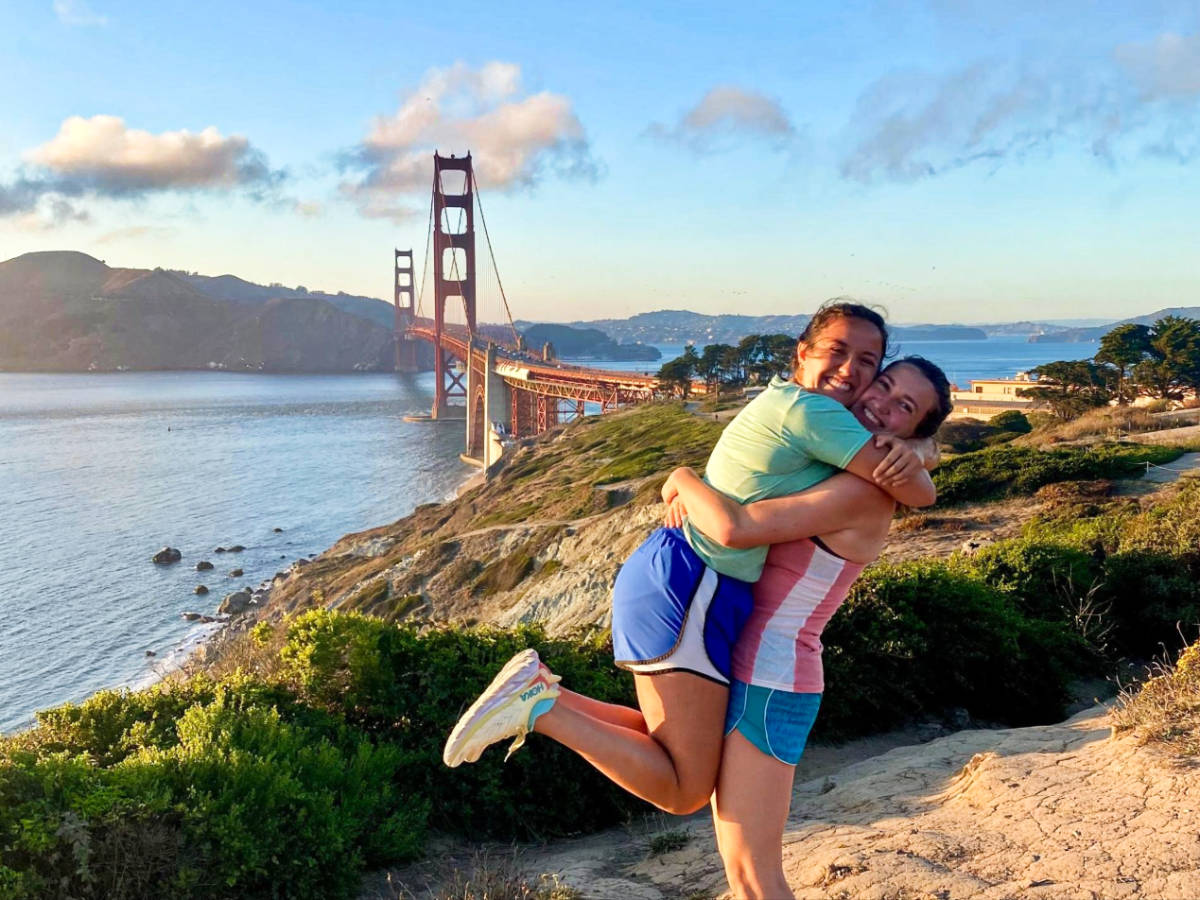 Travel Lemming Writer Laura McFarland and her partner, posing for a photo with the Golden Gate Bridge in the background