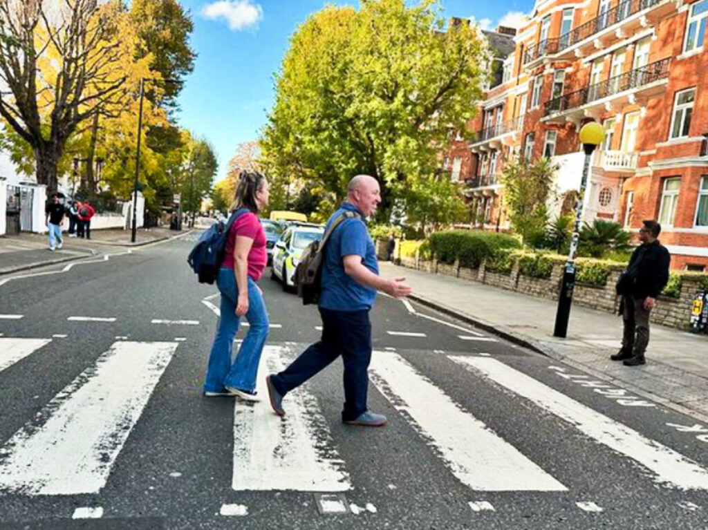 The author Laura and her husband walking on the Abbey Road