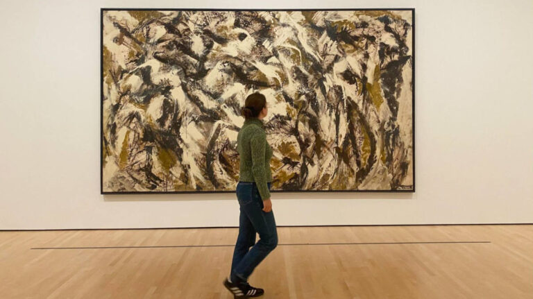 The author Laura looking at the abstract art in the Museum of Modern Art