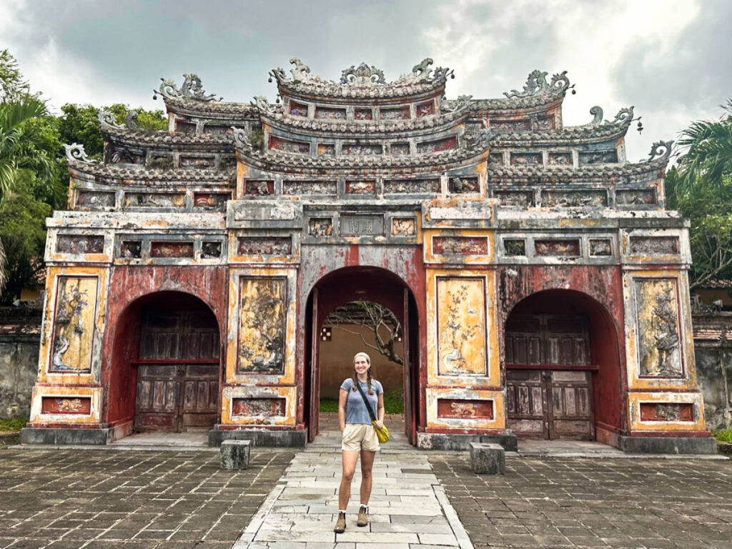 The author Laura McFarland posing in front of a gate in the old imperial Palace