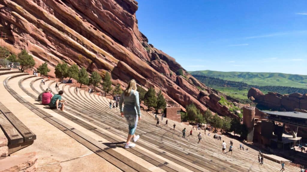 The author, Laura Falin, walking down the steep stairs of Red Rocks