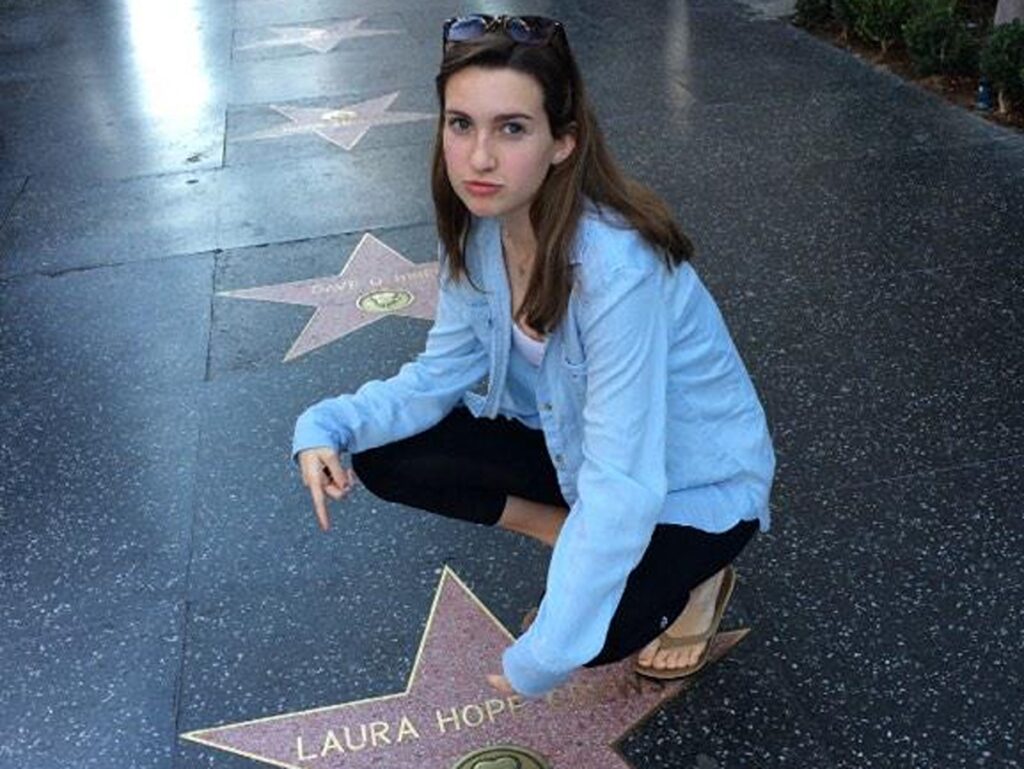 The author Laura McFarland posing for a photo at the Walk of Fame